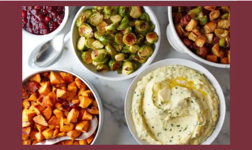 This photo shows several prepared food dishes including brussel sprouts, mashed potatoes, cranberry sauce and possibly cubed sweet potatoes.