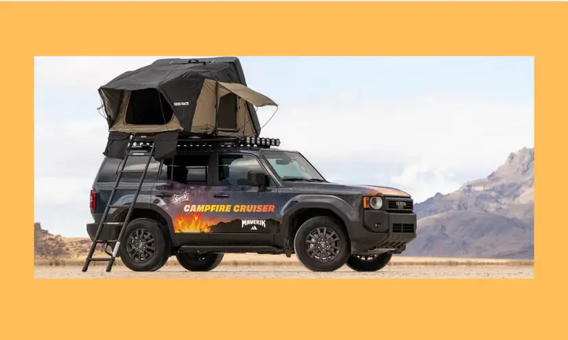 This photo features the black campfire cruiser vehicle with the pop up camping tent on top. The combo is surrounded by rugged mountains as if the adventure is waiting...and it is if you are the winner!