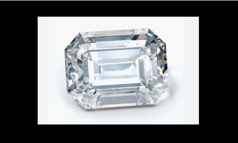 This is a photo of a simple yet elegant emerald cut diamond...like the one that will be on the necklace in this giveaway. There is no text, just the shimmering stone against a white background and a striking black border.