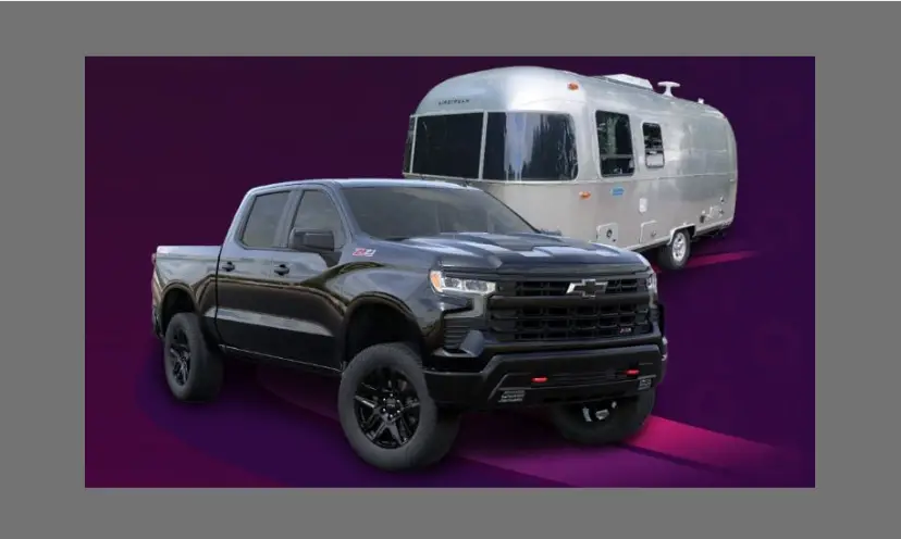 This photo has a vibrant purple background and features the Silverado truck and Airstream travel trailer that is waiting to be won in this giveaway!