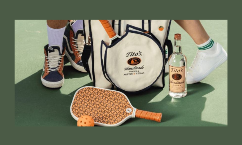 This photo features the pickleball set and mat in this giveaway. The prize is sitting by a bottle of Tito's handmade vodka to add more sparkle in the picture!