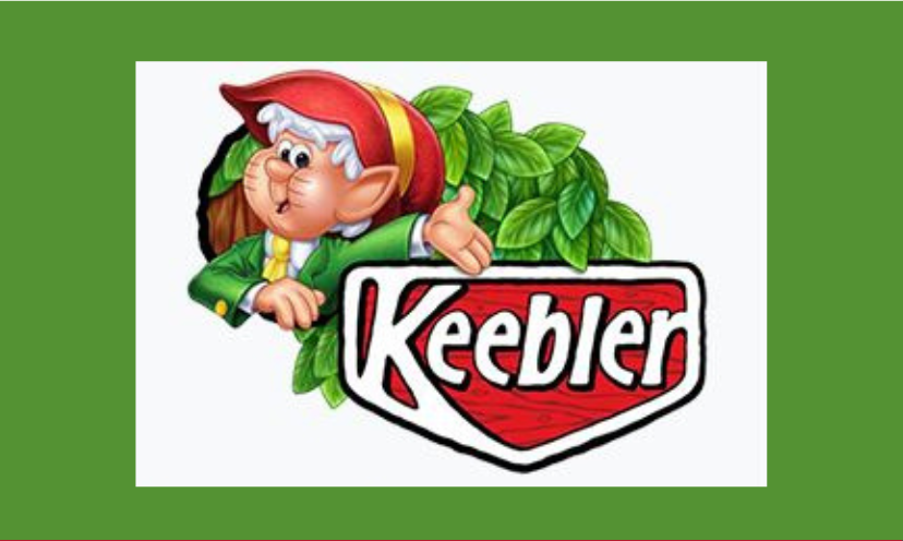 This is a photo of one of the whimsical Keebler elves. His surrounded by green leaves and the Keebler logo!
