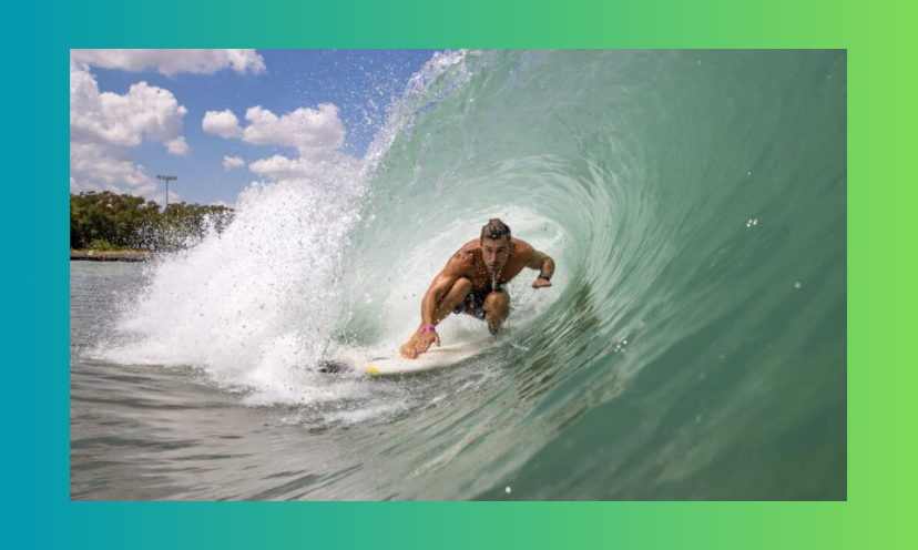 This photo shows a surfer on his wakeboard in the eye of a beautiful ocean wave!