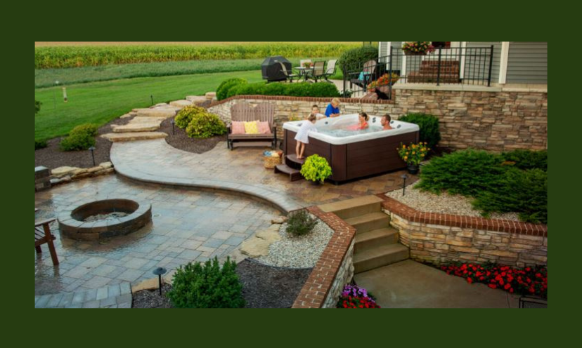 This is a photo of a dreamy backyard makeover complete with a hot tub, firepit and gorgeous landscaping!