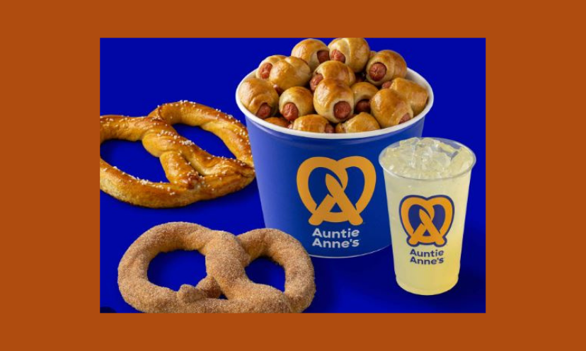 This is a photo of Auntie Anne's most loved snacks, It shows an up close picture of a regular pretzel, a cinnamon pretzel, hot dog pretzel bites and their ice cold lemonade...all of which could be your daily treat for a year!