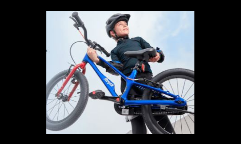 This is a photo of a young boy proudly holding his EZ Shark Bike...just like the one in this giveaway!