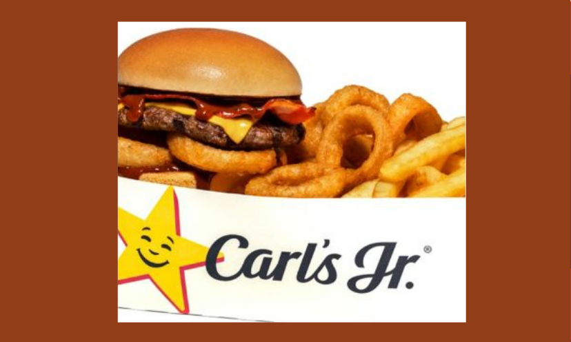 This is a photo of a mouthwatering burger, fries and onion rings from Carl's Jr...complete with their smiling star logo!
