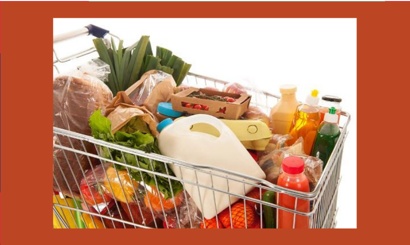 This is a photo of a grocery shopping cart packed to the brim with a variety of foods!