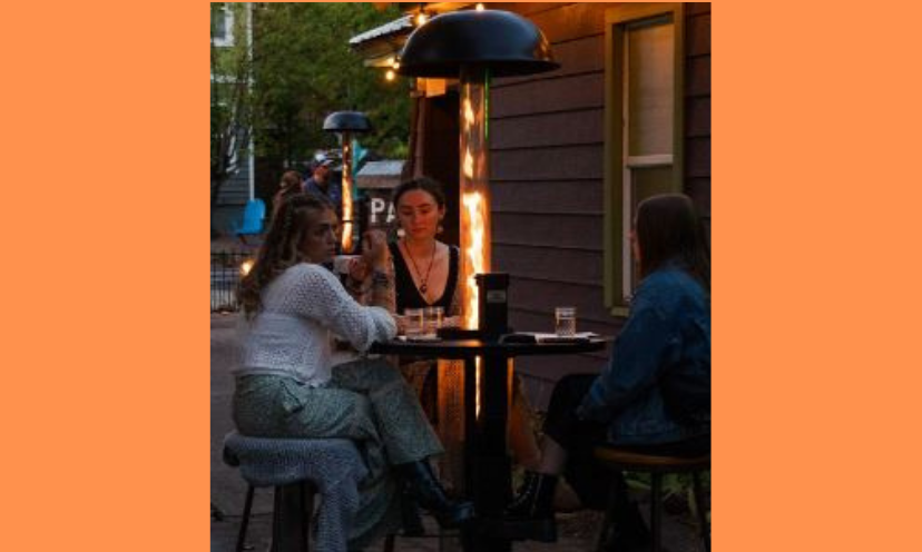 This photo features friends gathered around the cozy ambience of the Patiofyre Metro Jetlamp outdoor patio heater that is being offered to nine lucky winners in this giveaway!