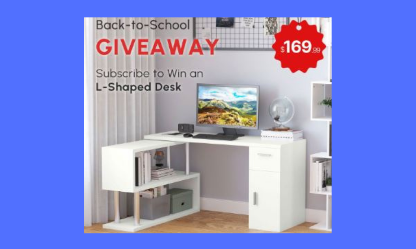 This is a picture of the L-shaped desk in this giveaway. It's ready to work or play with plenty of storage and room for your computer. The text says "Back to School Giveaway" and "subscribe to win an L- shaped desk". It also includes a $169.99 price tag. But it can be yours for FREE!