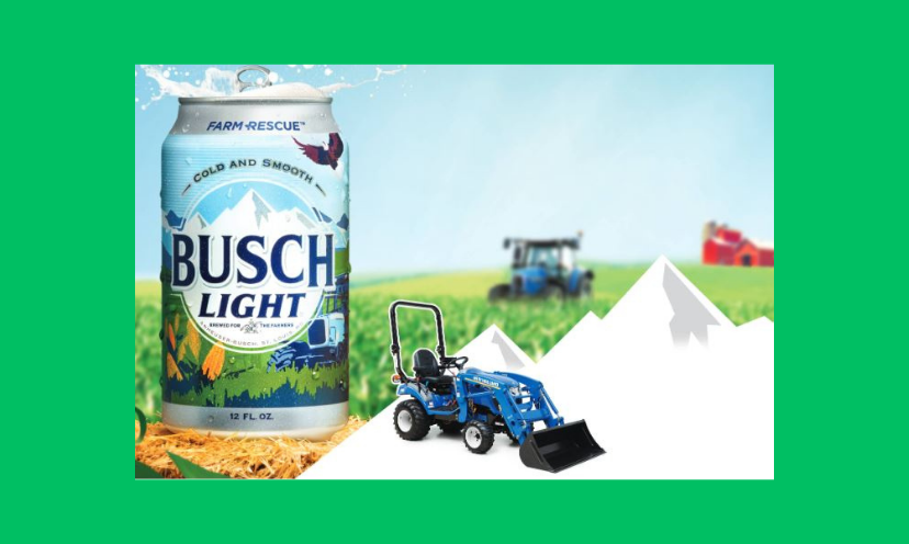 This photo features a can of Busch Light beside the compact tractor in this sweepstakes. In the background is a red barn, another tractor and a grassy field!