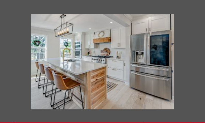 This is a photo of a newly upgraded kitchen featuring a huge island, impressive appliances and the feel of a new space...and you could win it all in this giveaway!