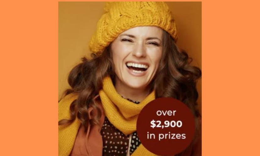 This is a photo of a beautiful young woman decked out in a happy smile and her chilly weather knitted hat and matching gold scarf. The caption says "over $2,900 in prizes"!