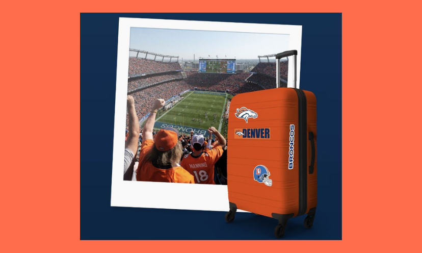 This photo is of another picture that captures the fans and field of a Broncos football game. Out in front is an orange suitcase decked out in Denver Bronco logos!