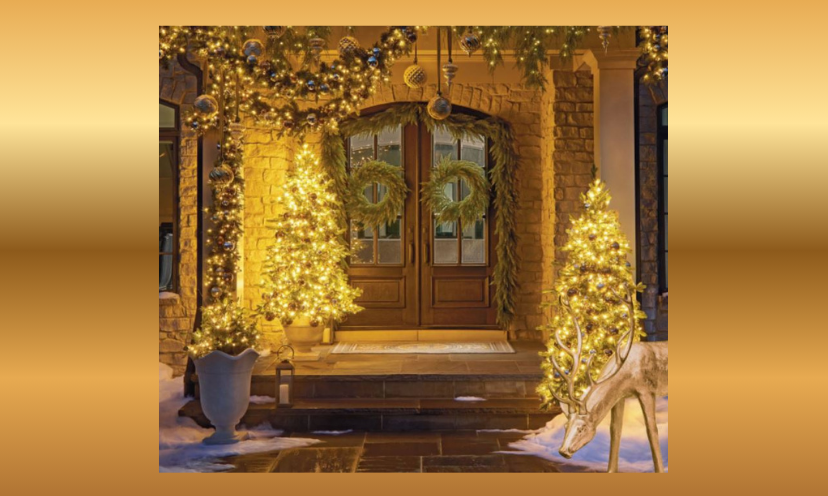 This photo is full of holiday decor that will get your creativity flowing. It shows a front porch with garland, trees and deer glowing with lights. It is an inviting entrance to home that can be acquired with this $10,000 giveaway!