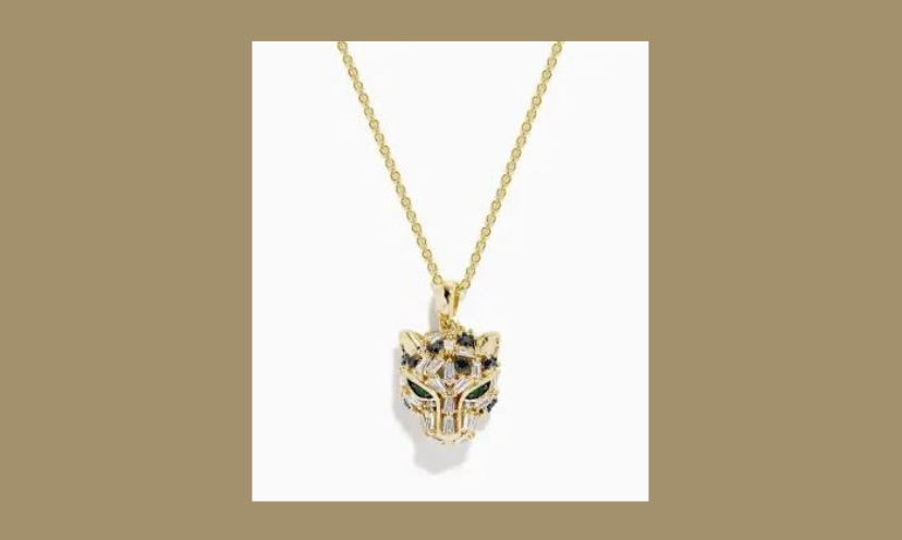 This photo is a close up of the striking panther pendant in 14 karat gold and diamonds that shine with a mysterious sparkle!