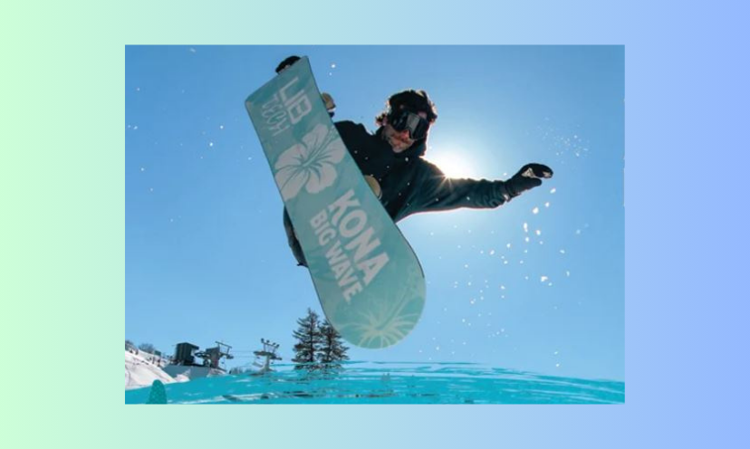 This photo shares the versatility of the collab snowboard offered in this giveaway...with the water beneath and the snowy hills in the background.