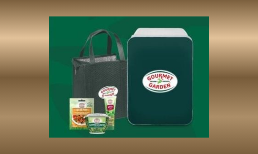 This photo shows the Gourmet Garden branded mini fridge and products you could win to go with the $10,000 in cash!