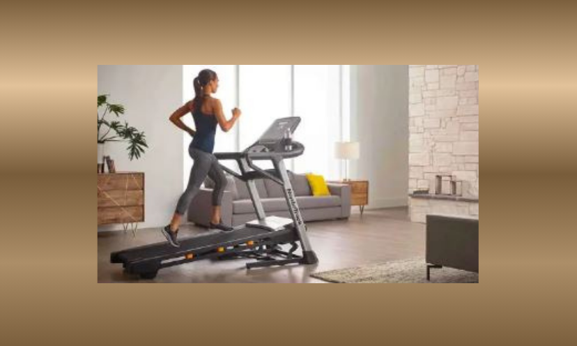 This photo is that of a woman running on the treadmill in this giveaway. She is keeping fit in the comfort of her living room with this foldable helper.