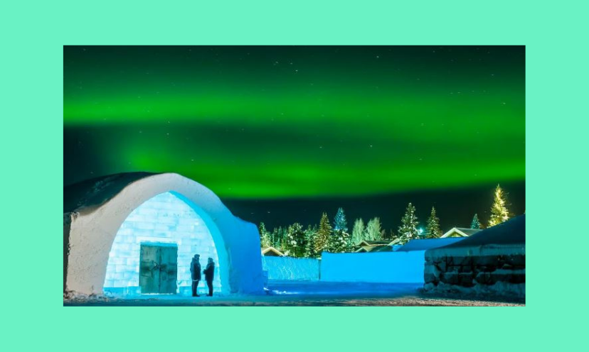 This amazing photo is of the Ice Hotel in Sweden...surrounded by the breathtaking Northern Lights and a winter scene with snow and evergreen trees!