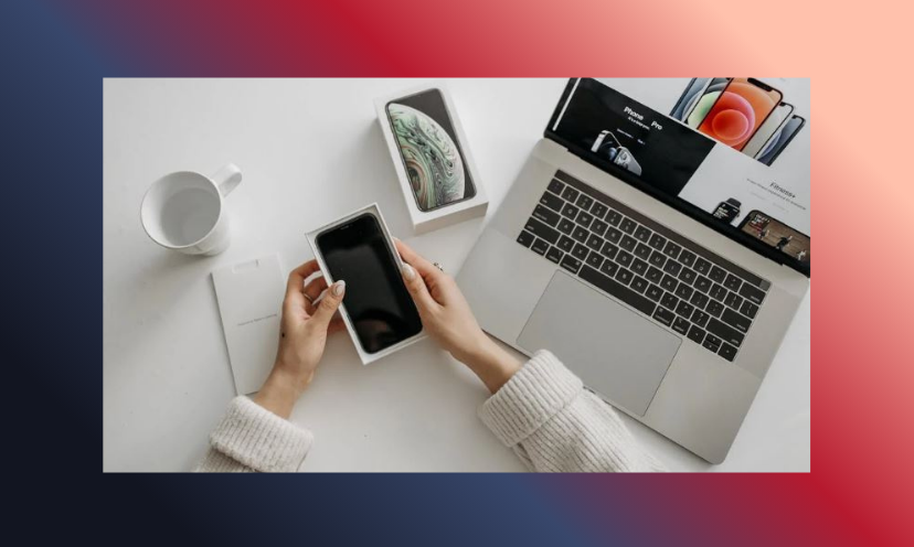 This Is a photo of two phones beside a computer...showing there are options in this tech filled world!