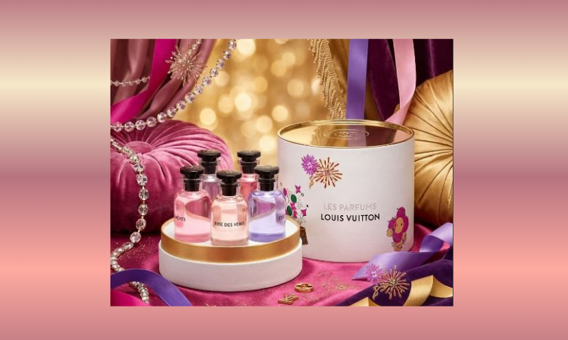 This photo provides a plush setting that includes the sparkle of the season among jewelry, lots of pink and the focal point of the Louis Vuitton perfume set offered in this giveaway!