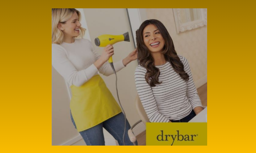 This photo is that of a hair stylist blow drying her customers hair to perfection. In the bottom corner is the drybar logo!