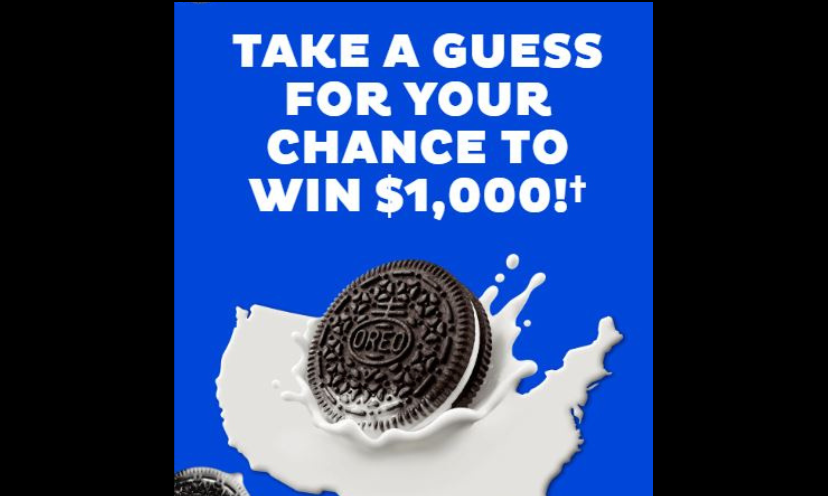 This photo features an Oreo cookie being dipped in it's perfect partner...milk! The caption says "take a guess for your chance to win $1,000!"