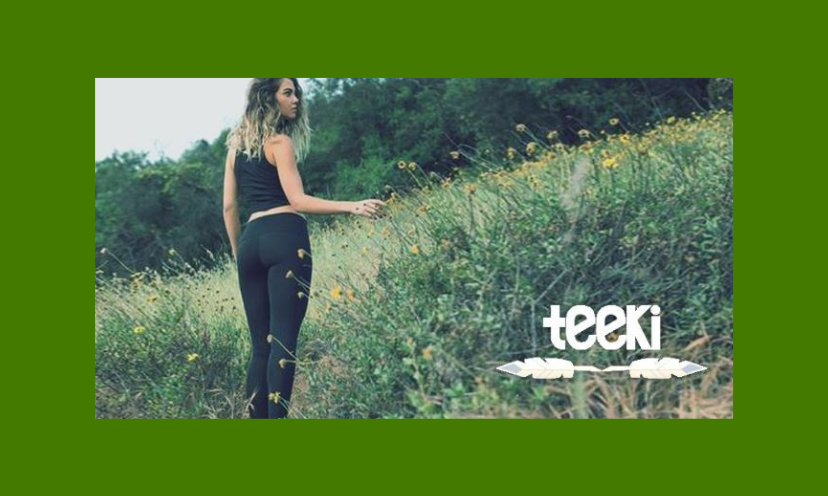This photo features a young woman in a field of wildflowers and grass...surrounded by trees. While in nature she is sporting a sample of the Teeki Boutique fashion offered in this shopping spree win!