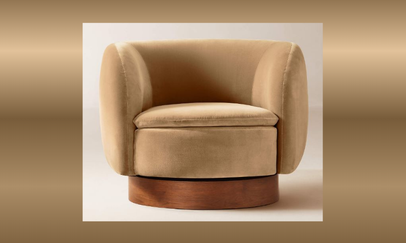 This photo focuses solely on the cozy and comfort filled velvet, swivel chair offered in this giveaway! The one featured here is a tan color with a rich wooden base!