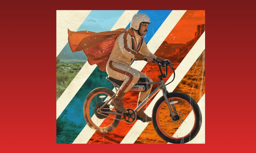 This is a photo of a rider, complete with a cape, riding the Stunt Double Ebike offered in this sweepstakes. The background is four stripes containing four different terrains!