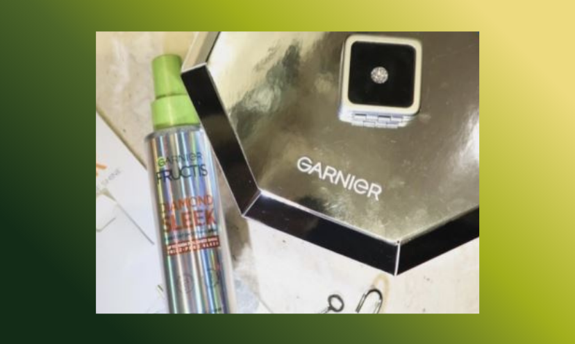 This photo shares an image of the sparkling diamond you could win...plus a bottle of the Garnier diamond shine smoothing spray!