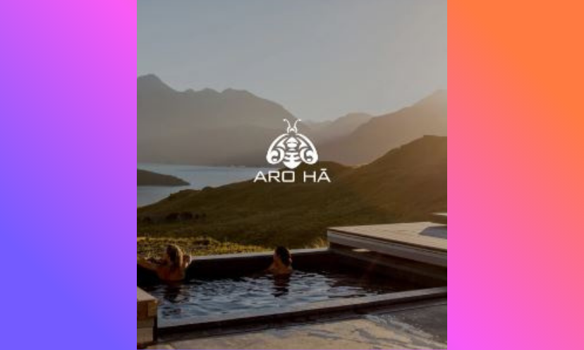 This is an image of two visitors soaking in the water and enjoying the relaxing mountain views in New Zealand at the ultimate human upgrade retreat as offered in this giveaway!