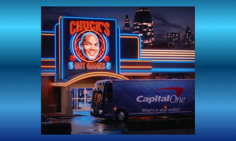 This photo features a similar neon sign as the one in the giveaway...just bigger and on a building with a city skyline in the background. Parked in front is a tractor trailer truck with the Capitol One logo. fitting as they are the sponsor of this giveaway!