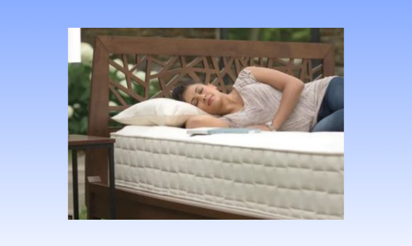 This is a photo of a young woman resting peacefully on a mattress like the one offered in this sweepstakes!