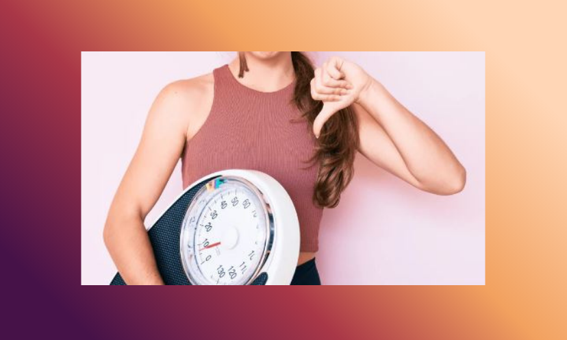 This photo represents skipping the scale when getting fit. It shows a woman holding the scale with a clear "thumbs down" attitude!