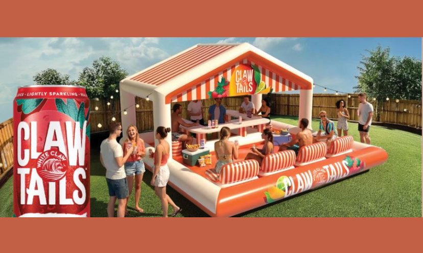 This is a photo of the $10,000 pool lounge for four that you could win this summer. It includes a built in bar and cushy seating four people. The photo shows a group gathered around this amazing set up!