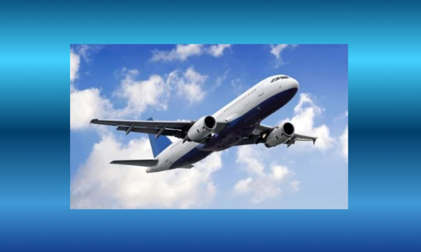 This is a photo of a commercial plane flying in the sky surrounded by fluffy clouds!