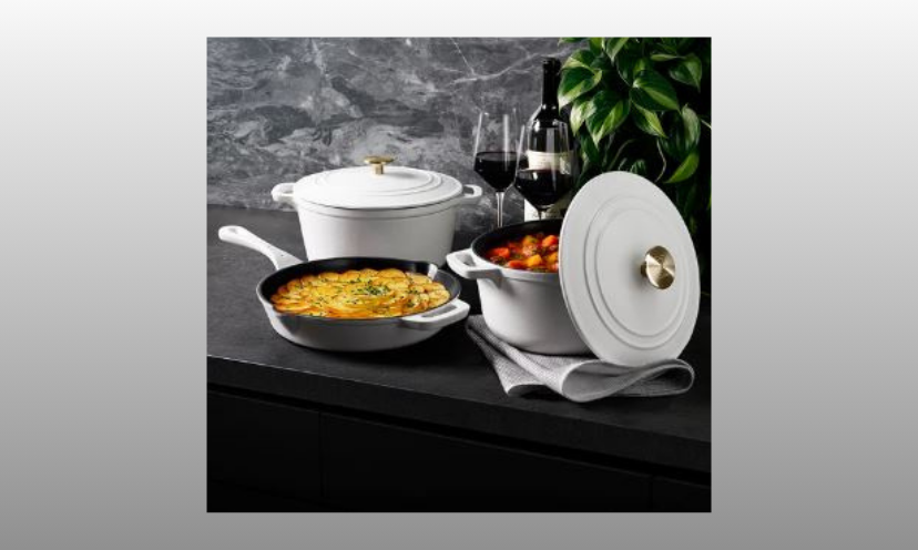 This photo features the beautiful cast iron cookware set you could win just in time for Mother's Day. This set is is beautifully created in white with a contrasting dark greyish - black interior!